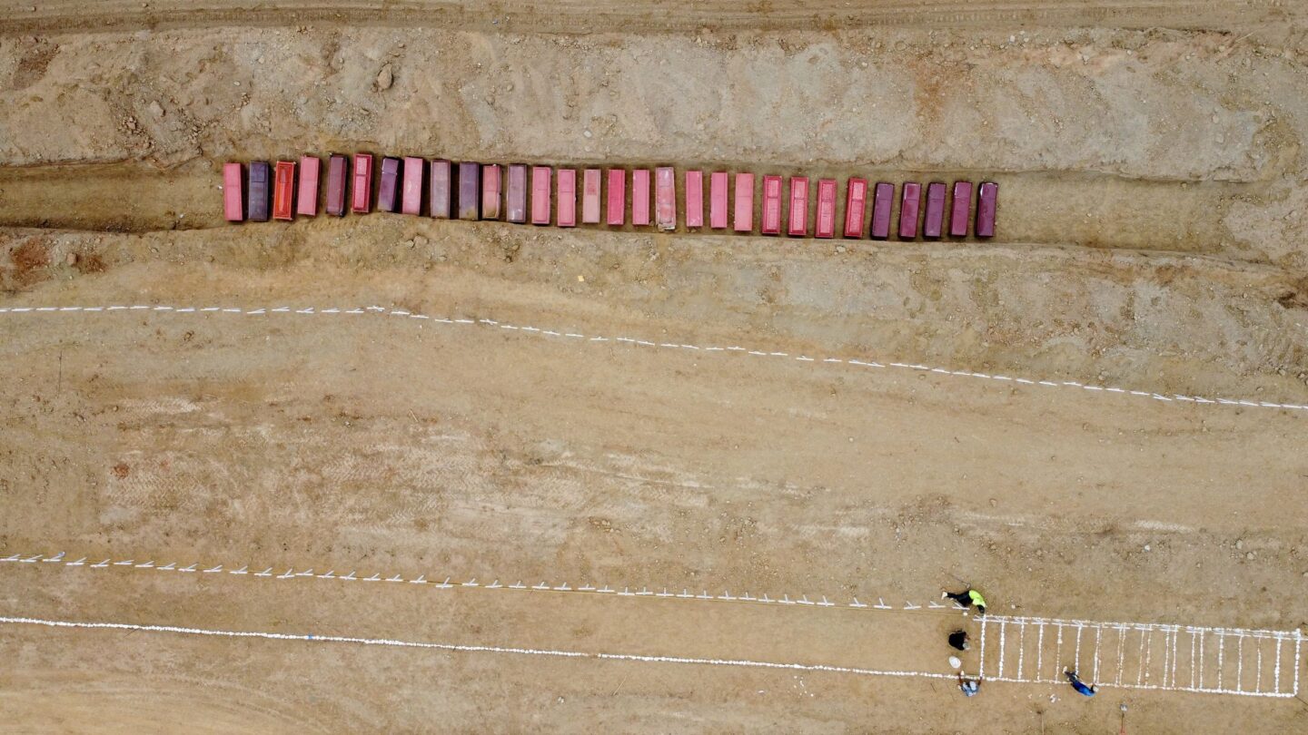 <i>Adriano Machado/Reuters via CNN Newsource</i><br/>A drone view of coffins on the day of the burial of earthquake victims