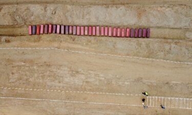A drone view of coffins on the day of the burial of earthquake victims