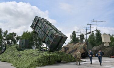 Search and rescue teams work at the site of a Russian missile and drone strike in Kyiv on July 7