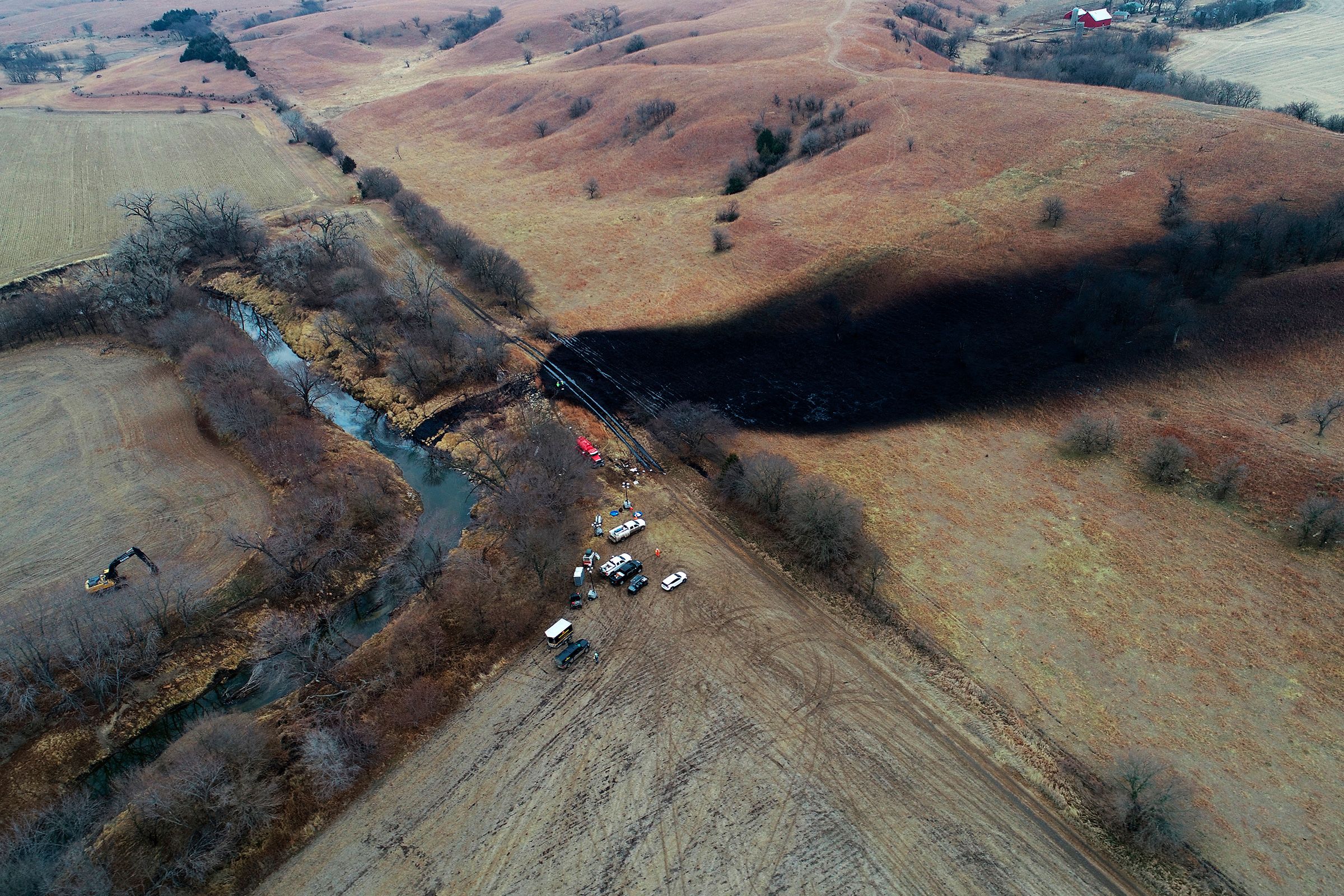 <i>Zeitview/AP/File via CNN Newsource</i><br/>Crews clean the area where the ruptured Keystone pipeline dumped oil into a creek in Washington County