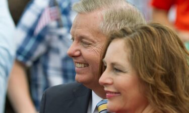 Sen. Lindsey Graham stands with his sister Darline Graham Nordone after formally announcing his campaign for the 2016 Republican presidential nomination in Central