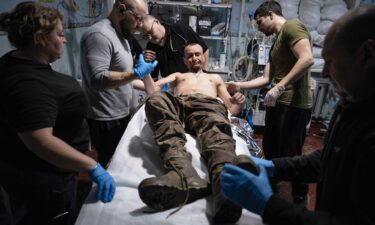 Military medics give first aid to a wounded soldier at a stabilisation point near Kostyantynivka in November 2025.