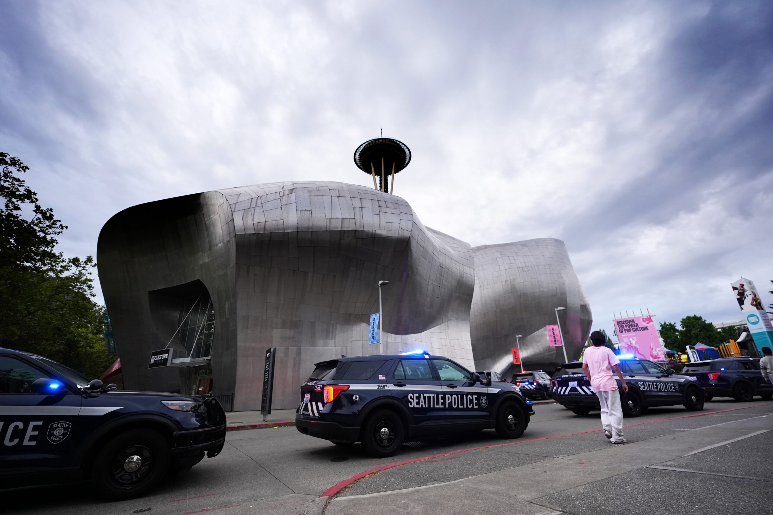Police respond to a shooting at Seattle Center during the Bite of Seattle food festival in Seattle on Sunday.