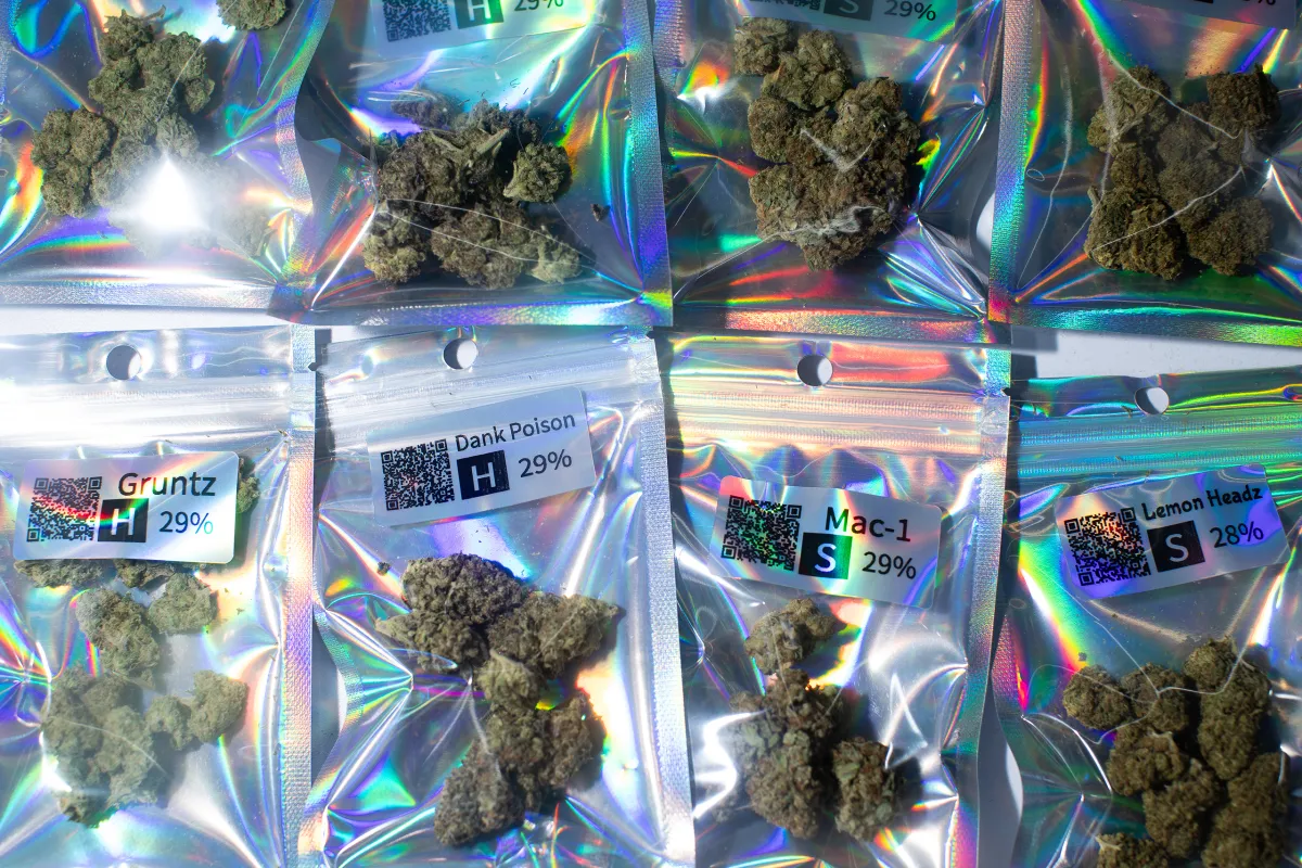 Individual packages of THC A flower are seen in a display case at a smoke shop in Austin on May 13, 2026. 