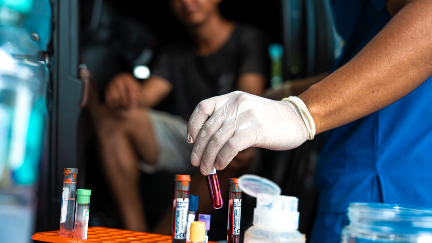 A nurse holds a blood sample taken from a participant as part of the CURE study in Usulutan, El Salvador, January 15, 2026.