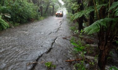 A rural road floods in Volcano Village on Hawaii Island
