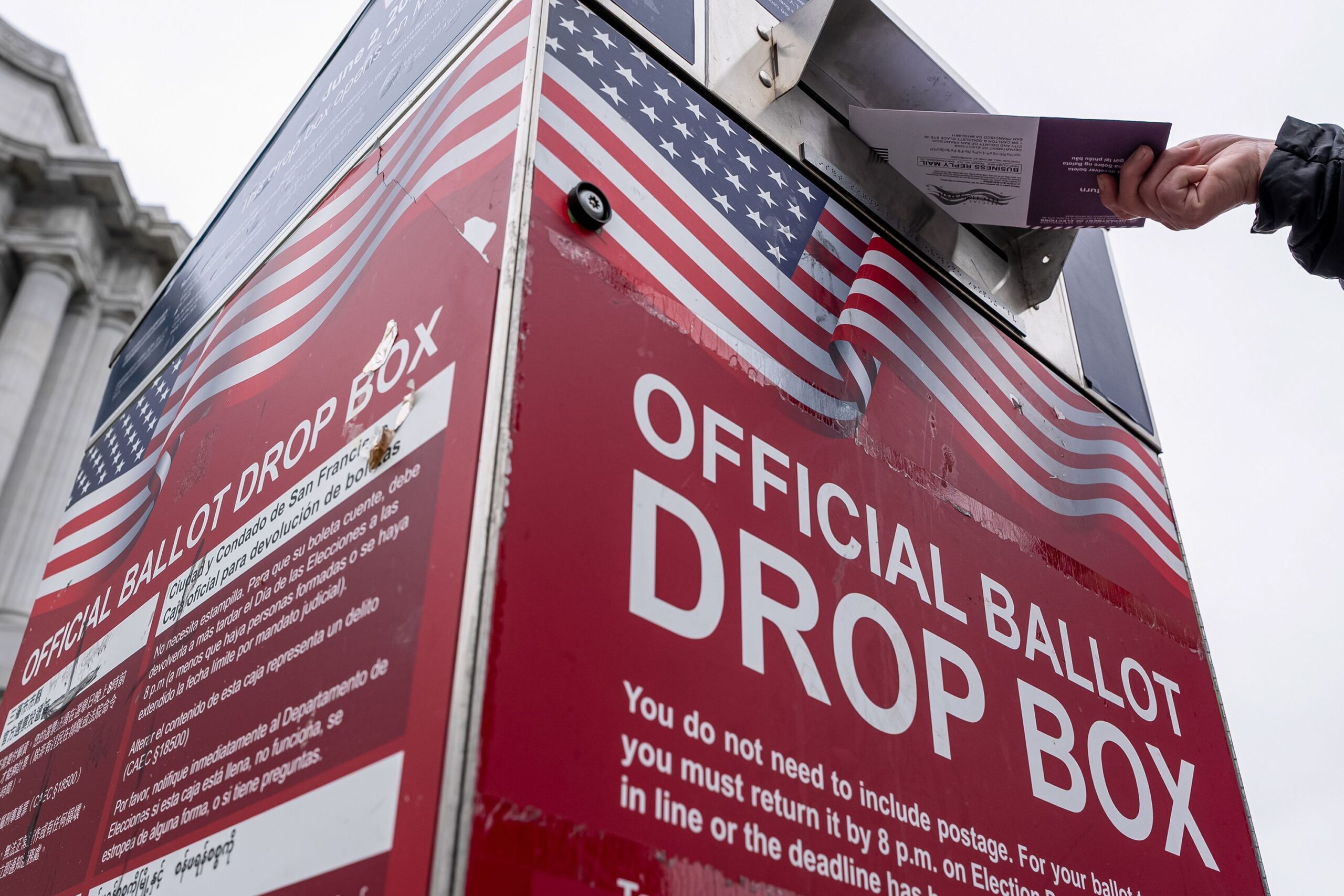 <i>David Paul Morris/Bloomberg/Getty Images via CNN Newsource</i><br/>A voter drops their ballot at an official ballot drop box outside City Hall during a primary election in San Francisco