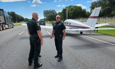 A small plane sits on the side of Interstate 10 in Pensacola
