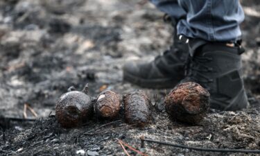 Bomb disposal experts work on a site after the discovery of shells from World War II in a neighborhood of Le Porge on Monday.
