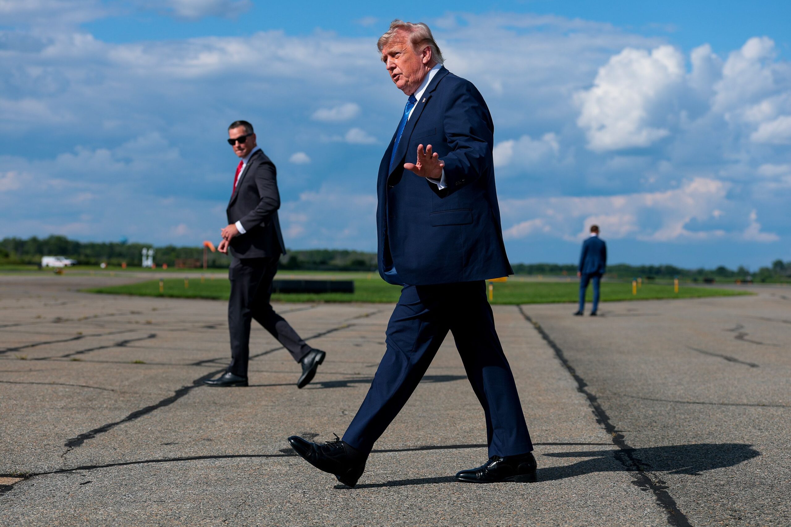 <i>Anna Moneymaker/Getty Images via CNN Newsource</i><br/>President Donald Trump walks off Air Force One at the Morristown Municipal Airport on July 31