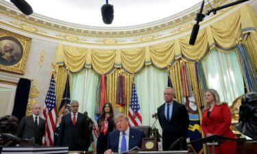 President Donald Trump attends an event in the Oval Office in Washington