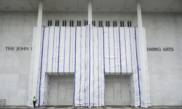 A tarp covers the facade of the John F. Kennedy Memorial Center following a federal judge’s order to remove US President Donald Trump's name from the institution in Washington