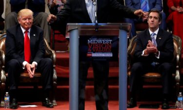 This 2016 photo shows Donald Trump with Michael Cohen during a campaign stop at the New Spirit Revival Center church in Cleveland Heights