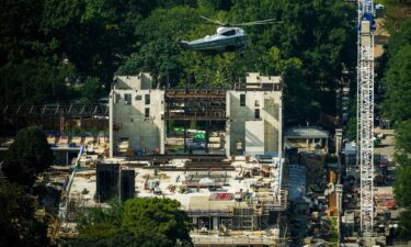 Marine One carries President Donald Trump as it passes over construction on the new White House ballroom