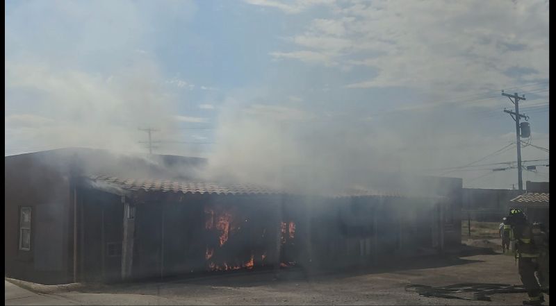 A fire burns a single-story apartment complex in Las Cruces.