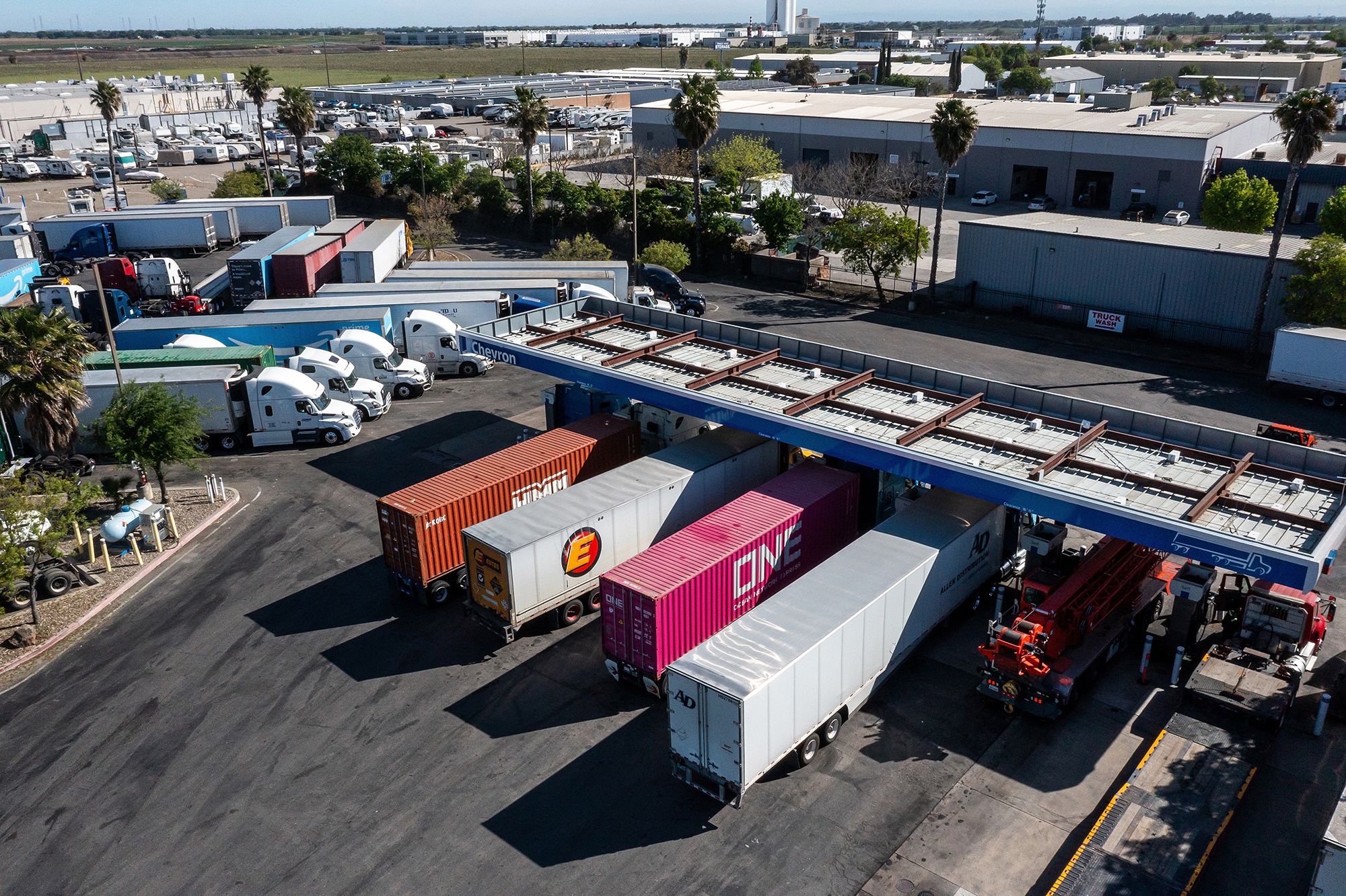 <i>David Paul Morris/Bloomberg/Getty Images via CNN Newsource</i><br/>Drivers refuel tractor trailers with diesel fuel at a Chevron truck stop in Tracy