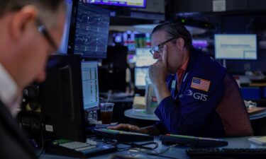 A trader works on the floor of the New York Stock Exchange on August 19.