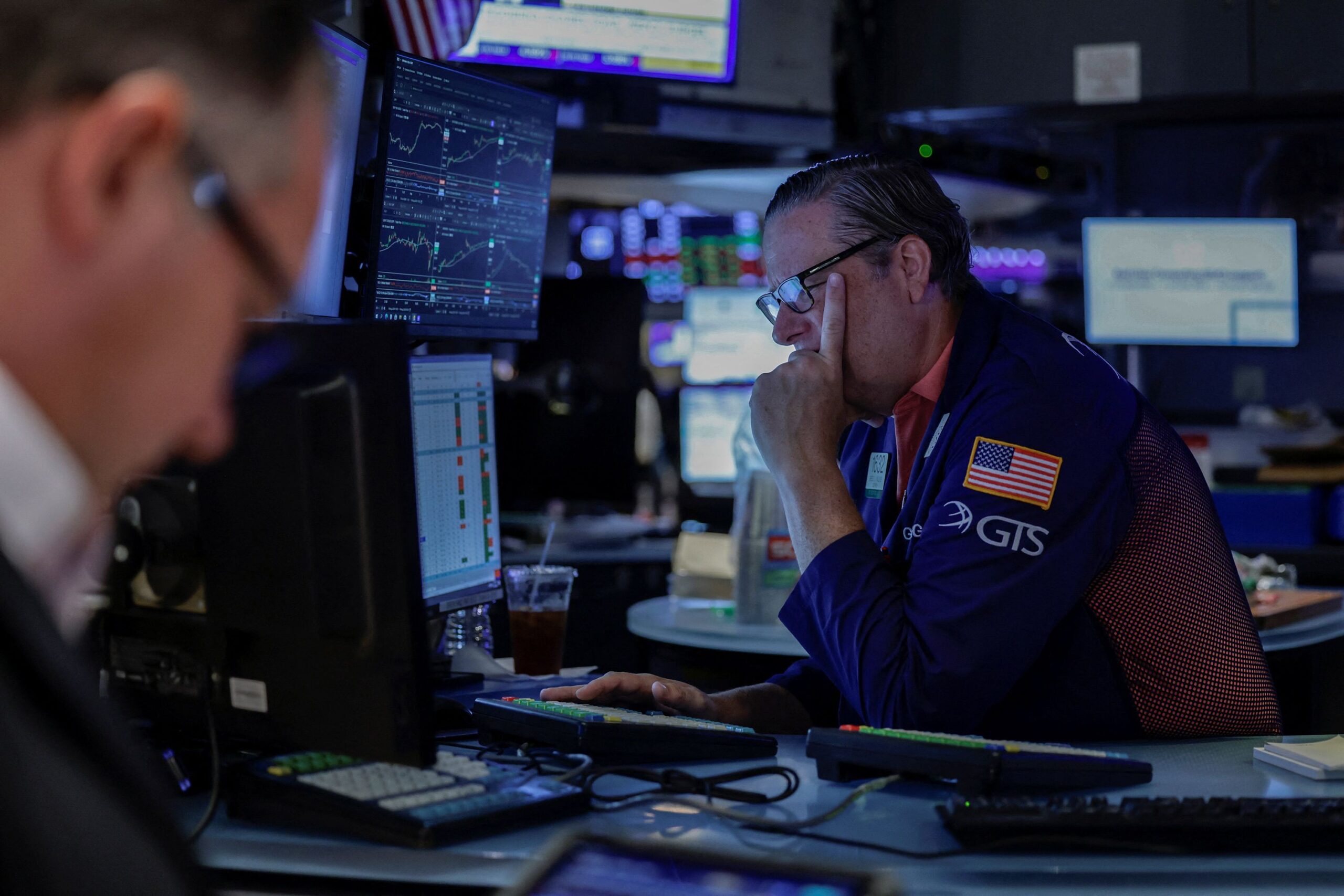 <i>Jeenah Moon/Reuters via CNN Newsource</i><br/>A trader works on the floor of the New York Stock Exchange on August 19.