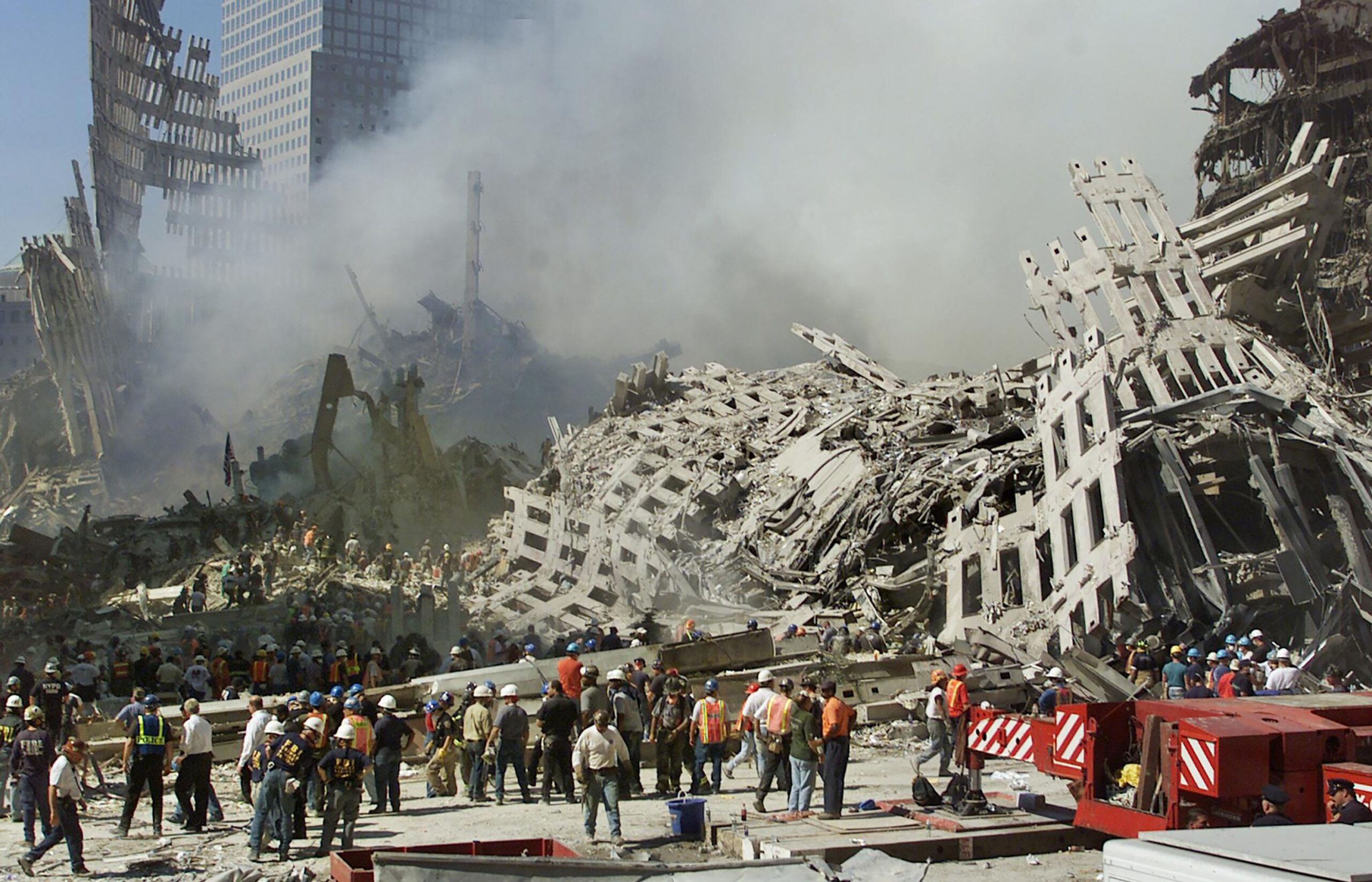 <i>Beth A. Keiser/AFP/Getty Images via CNN Newsource</i><br/>Smoke rises from the rubble of the World Trade Center in September 2001