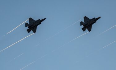 F-35s fly in formation with their afterburners during a kick-off celebration for the "Great American State Fair" on the National Mall in Washington
