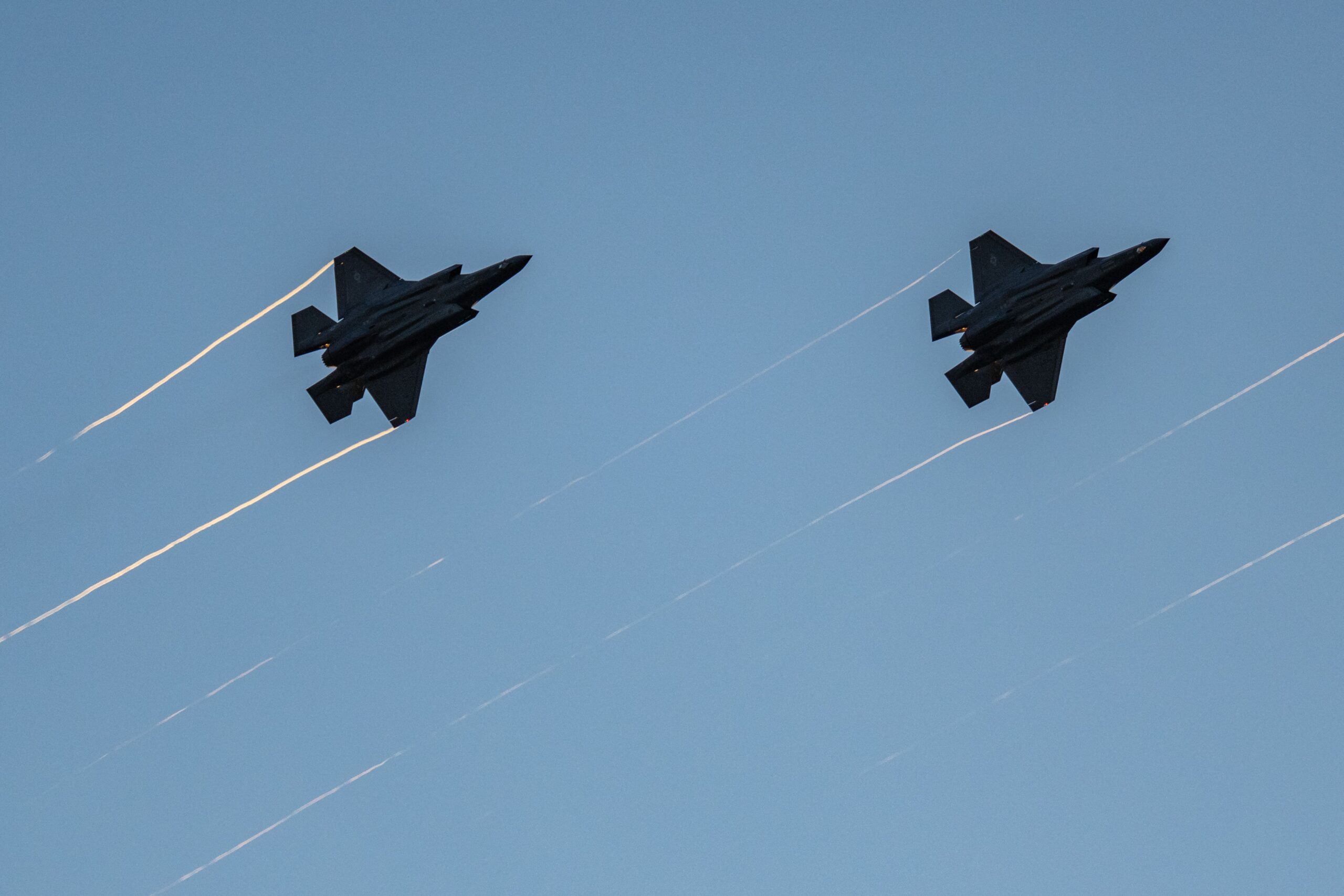 <i>Ken Cedeno/AFP/Getty Images via CNN Newsource</i><br/>F-35s fly in formation with their afterburners during a kick-off celebration for the "Great American State Fair" on the National Mall in Washington