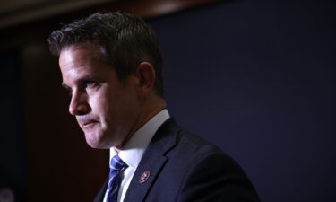 Former Illinois Rep. Adam Kinzinger speaks after the Republican House caucus voted to remove Rep. Liz Cheney of her leadership