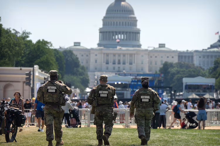 In this June 30, 2026, file photo, National Guard members patrol the Great American State Fair on the National Mall, in Washington, D.C.
