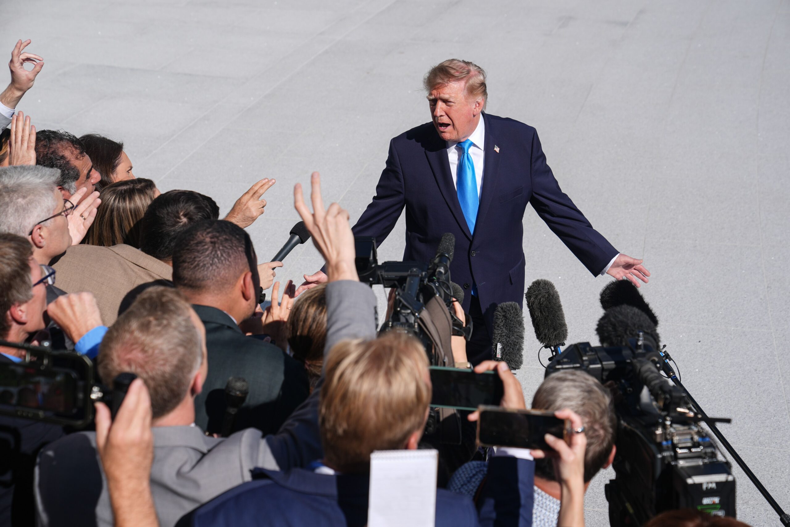 <i>Mehmet Eser/Anadolu/Getty Images via CNN Newsource</i><br/>President Donald Trump speaks to press members before boarding Marine One on the South Lawn of the White House in Washington DC