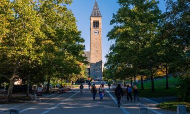 Students walk along Cornell University’s main promenade on a quiet morning on October 6