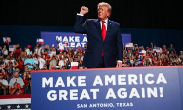 President Donald Trump walks out on stage to speak during a campaign rally at the Freeman Coliseum on October 7
