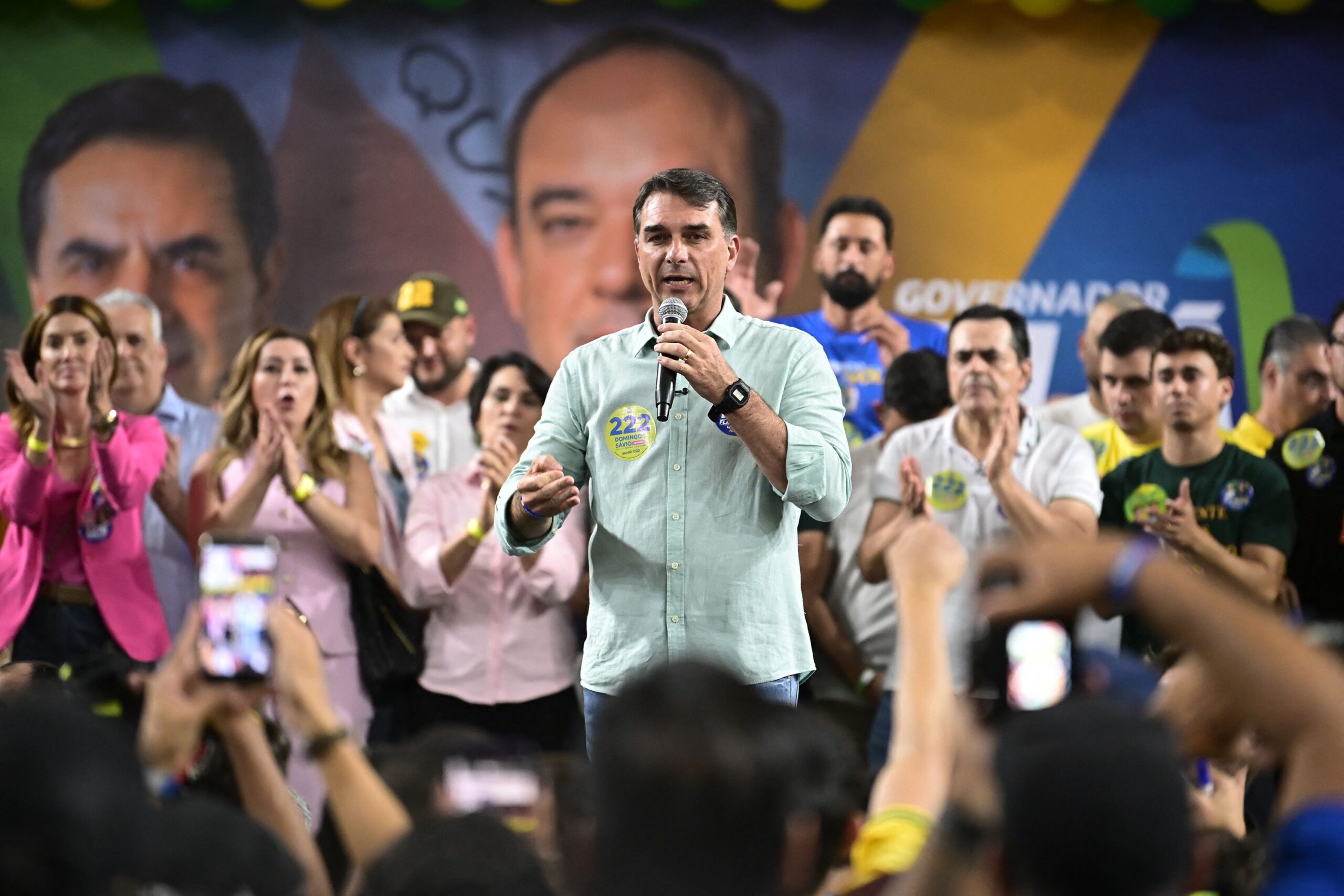 <i>Sergio Lima/AFP/Getty Images via CNN Newsource</i><br/>Brazilian right-wing presidential candidate Flavio Bolsonaro holds a picture of his father