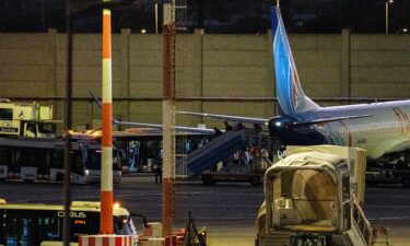 A plane carrying passengers from an earlier Flydubai flight that was diverted to Saudi Arabia arrives at Ben Gurion Airport on September 30