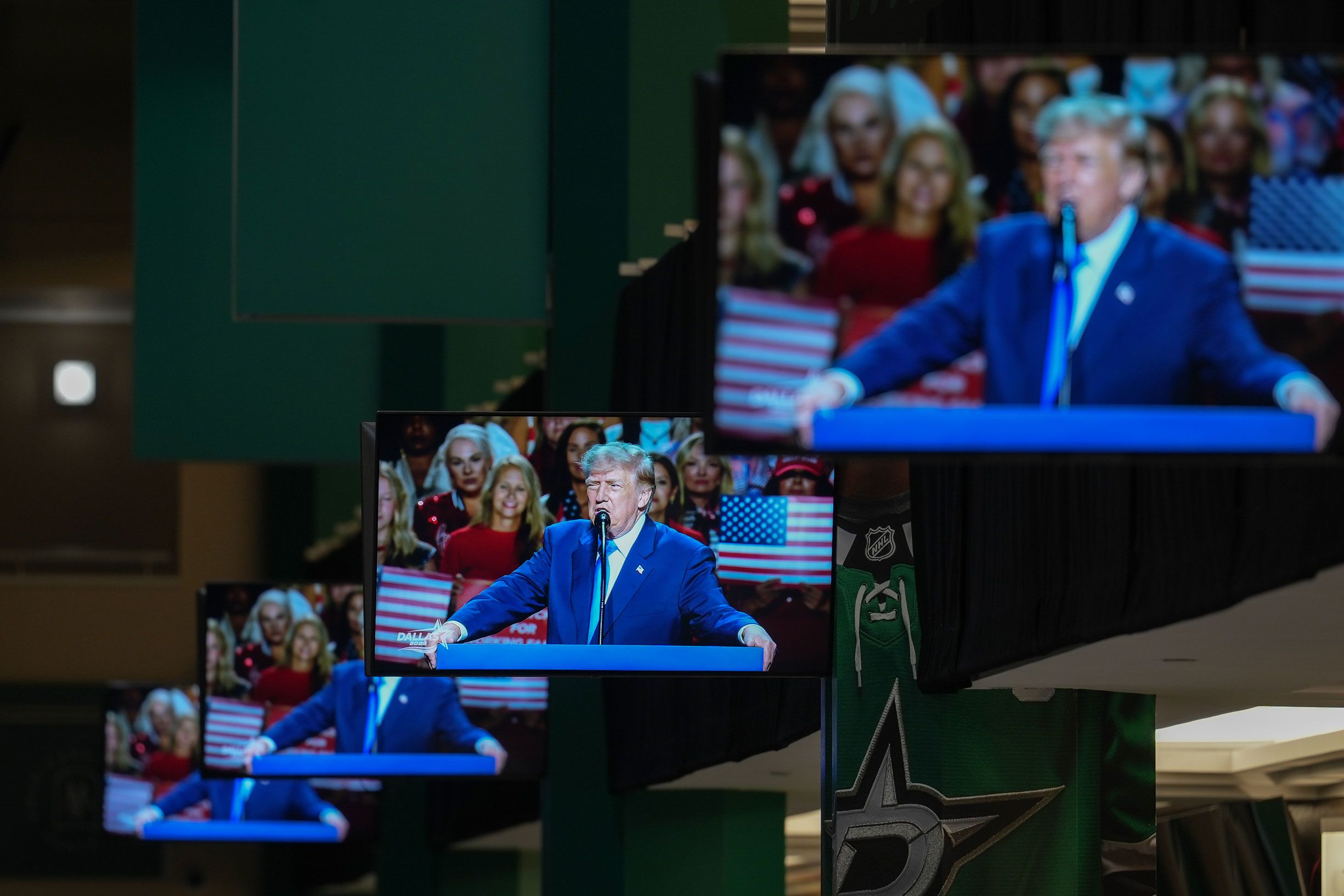 <i>Al Drago/Bloomberg/Getty Images via CNN Newsource</i><br/>President Donald Trump speaks on screens during the first day of the Republican Midterm Convention at the American Airlines Center in Dallas