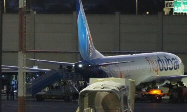 People disembark from a FlyDubai flight carrying Israeli passengers who had earlier been aboard another FlyDubai aircraft that made an emergency landing in Saudi Arabia on September 30.