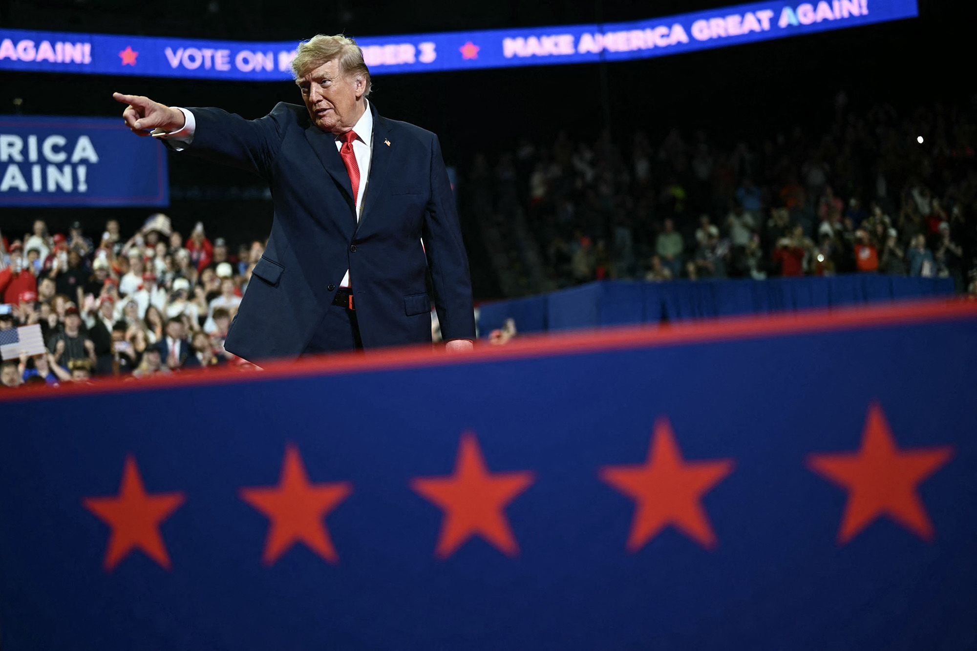 <i>Kent Nishimura/AFP/Getty Images via CNN Newsource</i><br/>President Donald Trump gestures during a campaign rally at the Covelli Centre in Youngstown
