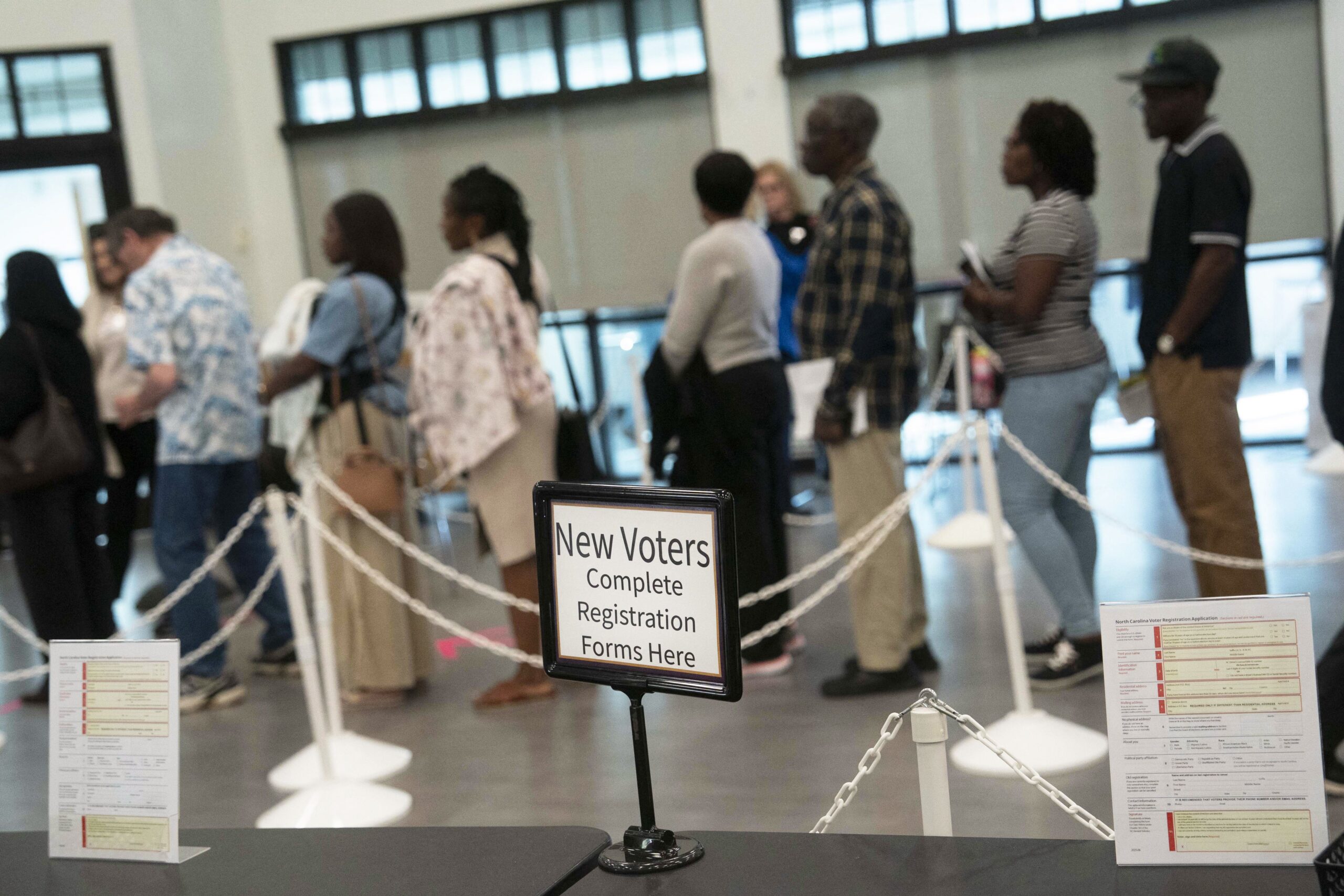 <i>Allison Joyce/AFP/Getty Images via CNN Newsource</i><br/>People wait to vote in early voting for the midterm elections on October 25 in Cary