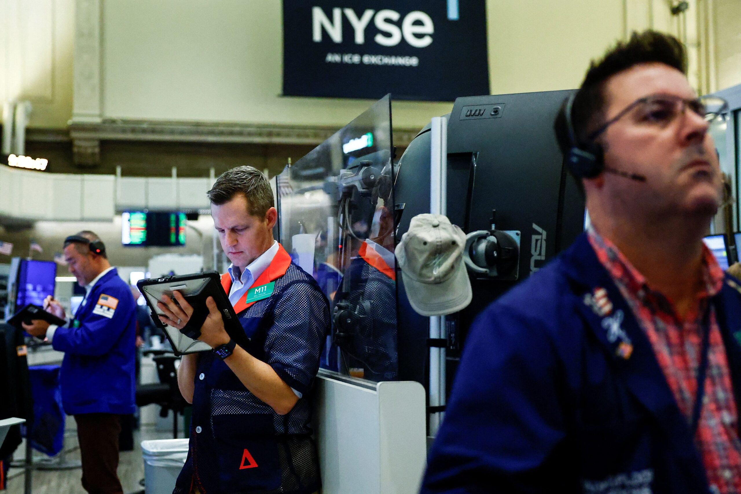 <i>Jeenah Moon/Reuters via CNN Newsource</i><br/>Traders work on the floor at the New York Stock Exchange in New York City