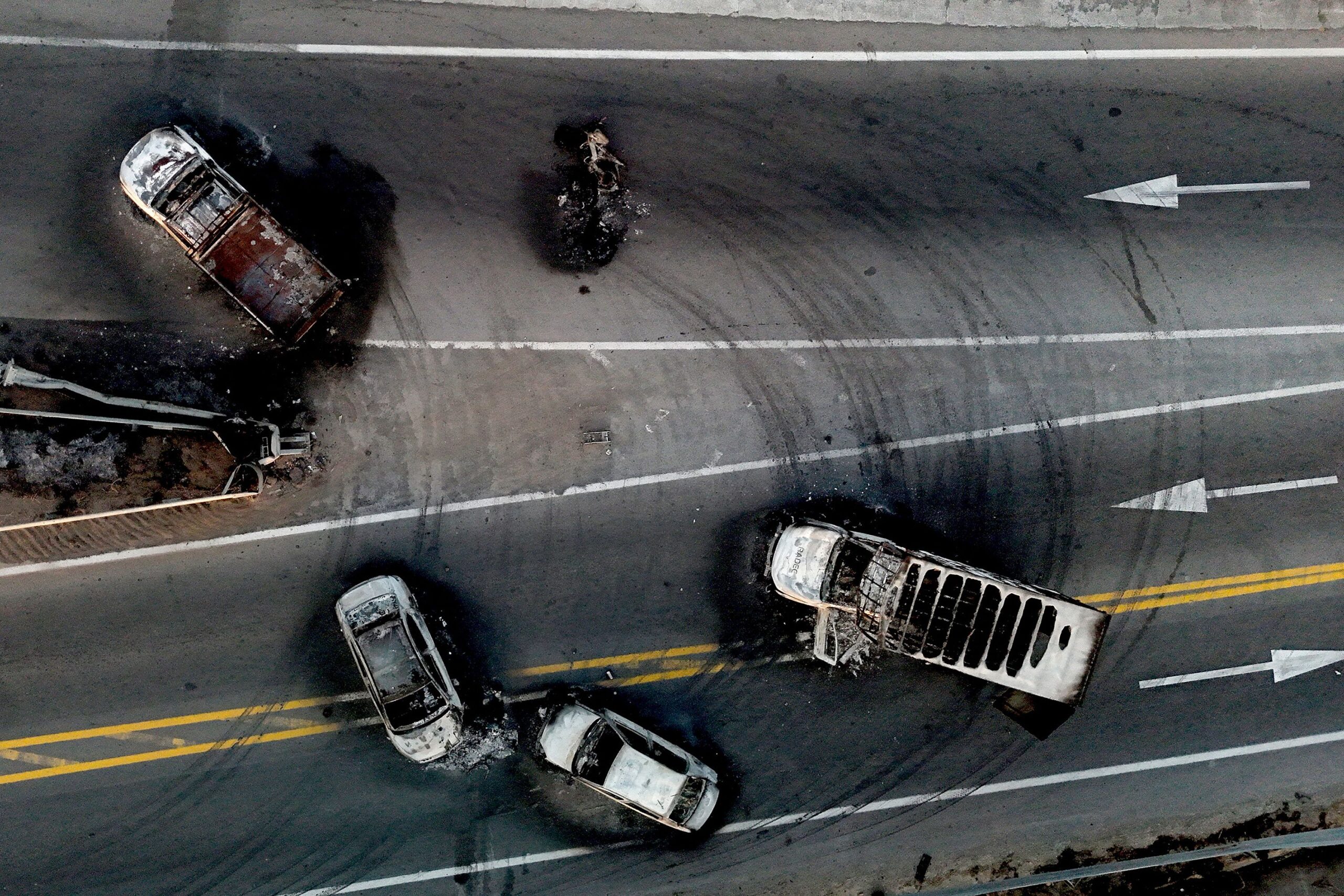 <i>Ulises Ruiz/AFP/Getty Images via CNN Newsource</i><br/>This aerial view shows burned cars and trucks