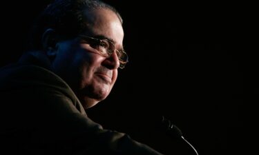 US Supreme Court Associate Justice Antonin Scalia pauses as he addresses a Northern Virginia Technology Council breakfast December 13