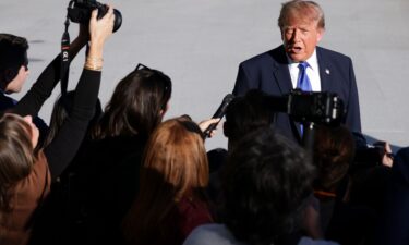 President Donald Trump speak to members of the media as he departs on the South Lawn of the White House on October 22.
