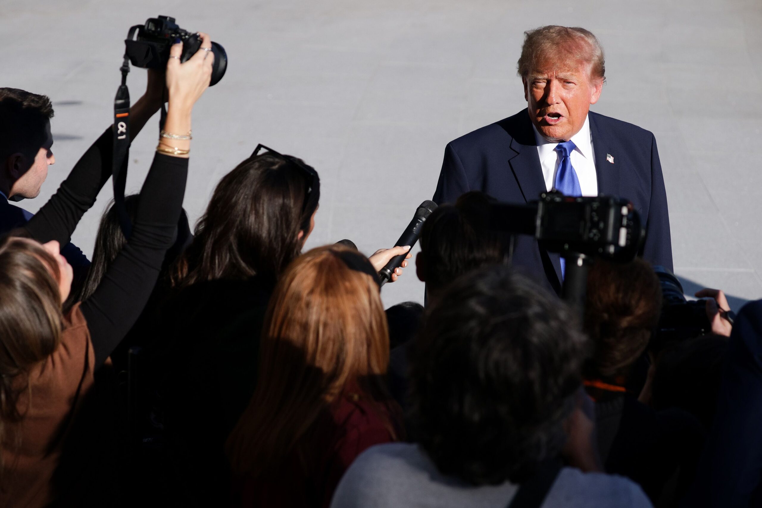<i>Alex Wong/Getty Images via CNN Newsource</i><br/>President Donald Trump speak to members of the media as he departs on the South Lawn of the White House on October 22.