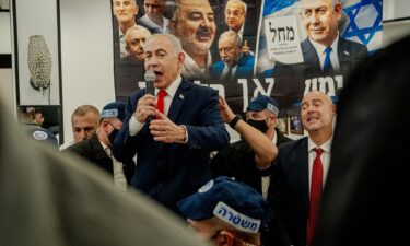 Israeli Prime Minister Benjamin Netanyahu speaks to local residents and supporters during a campaign stop at HaTikva Market in Tel Aviv on Thursday.