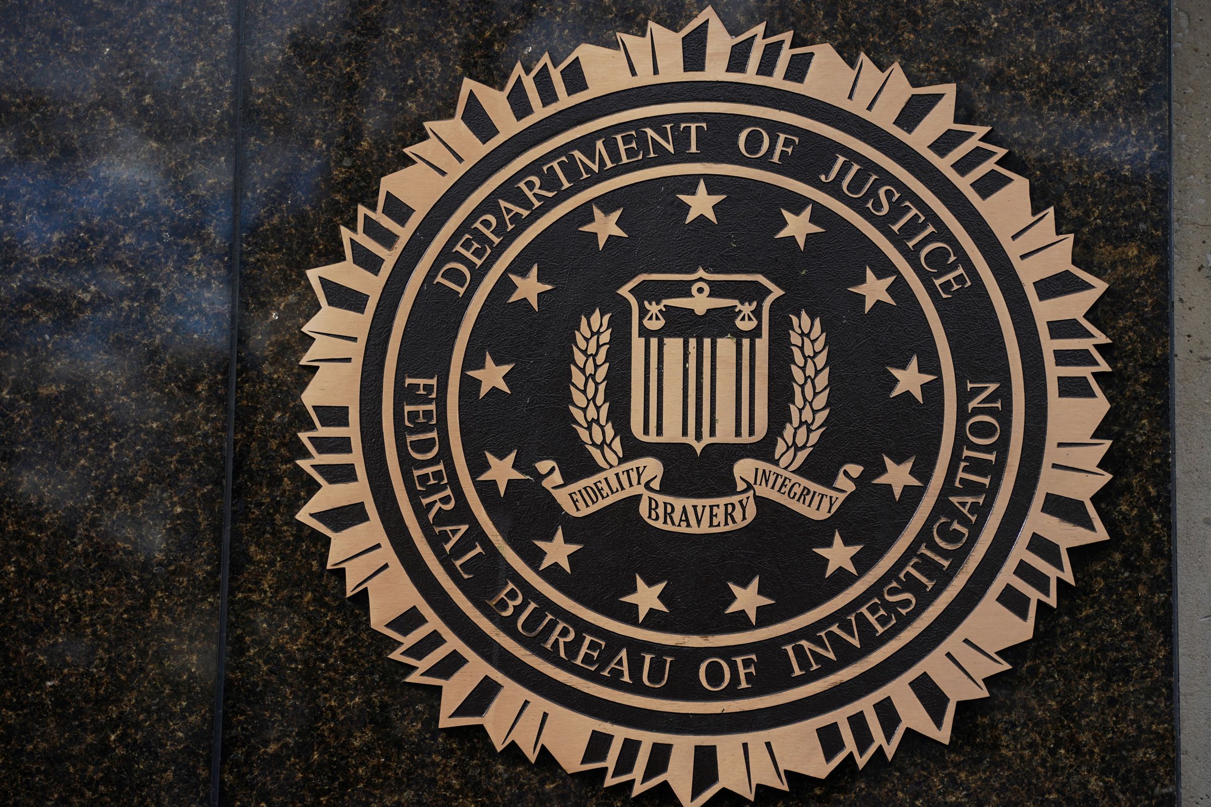 <i>Nathan Howard/Reuters via CNN Newsource</i><br/>The logo of the Federal Bureau of Investigation displayed on the building in Washington