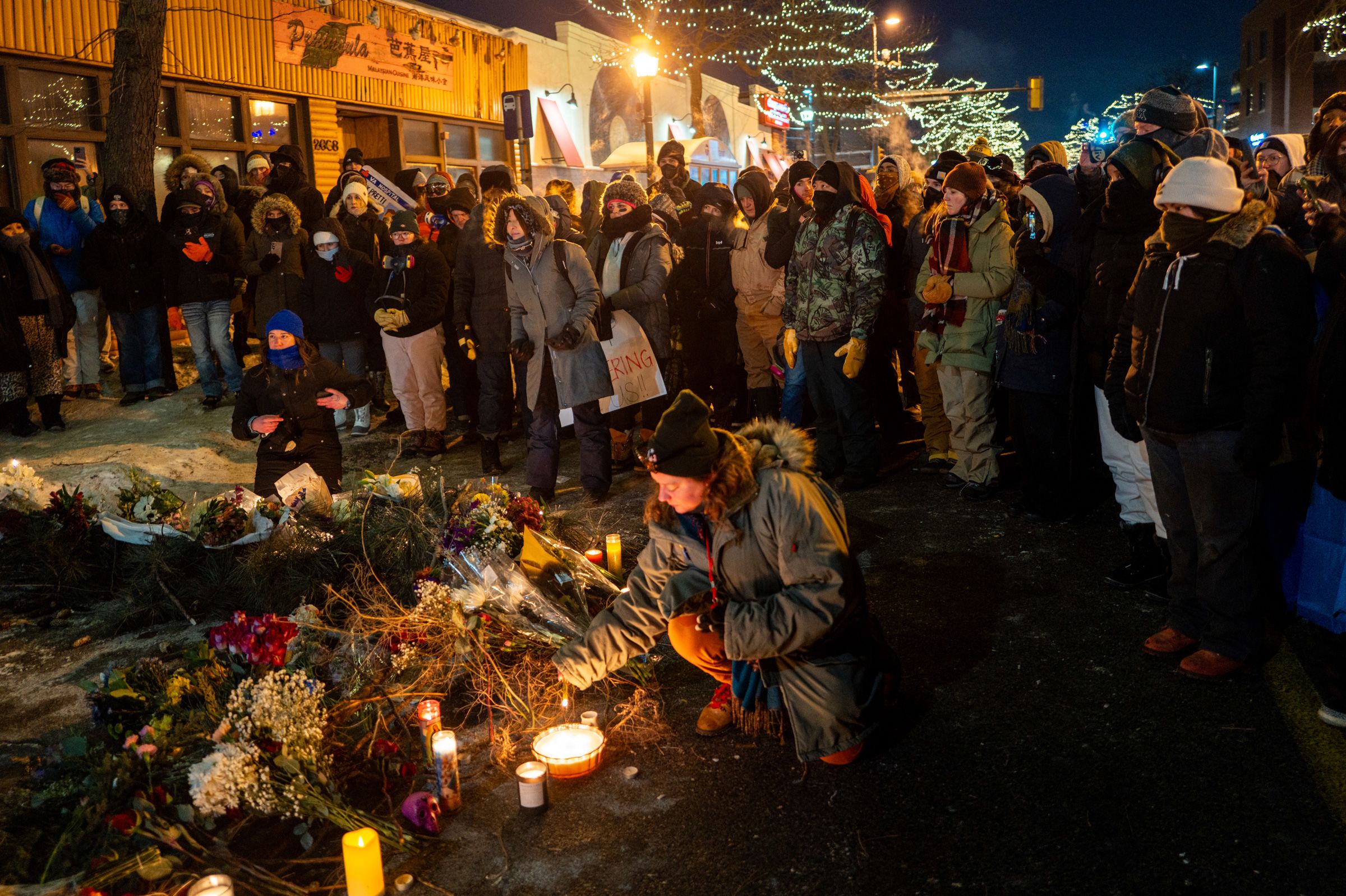 <i>Roberto Schmidt/AFP/Getty Images via CNN Newsource</i><br/>An image of Alex Pretti is seen at a makeshift memorial in the area where he was shot dead by federal immigration agents in Minneapolis