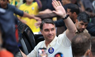 Flávio Bolsonaro waves after casting his vote in Rio de Janeiro on Sunday.